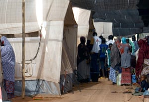 People gather at the health centre in Lazaret, near Niamey in Niger, in April 2015, where patients suffering from meningitis are being treated.