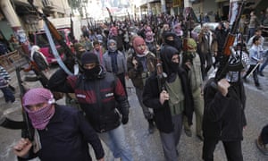 Syrian rebels march in a show of strength during a demonstration in Idlib, Syria.