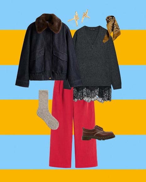 A composite image of a denim jacket with faux fur collar, lightning-shaped stud earrings, ochre printed neck scarf, grey jumper with lace trim, red trousers, brown chunky lace-up shoes and beige marl socks, all on a blue and orange horizontal striped background.