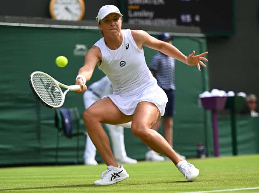 Favourite Iga Swiatek hits a forehand.