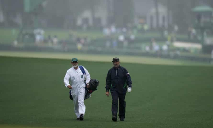 Jose Maria Olazabal walks with his caddie Emilio Pereira on the first fairway.