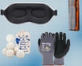 An eye mask, a comb, wool dryer balls, and a pair of gloves