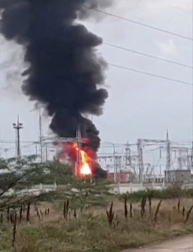 Smoke rises above an electrical transformer substation, which caught fire after an explosion in Dzhankoi, Crimea, on August 16.
