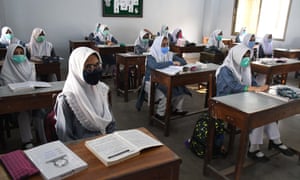 Coronavirus live news: nearly a fifth of South Africans may have had Covid; record new cases in the Netherlands - Students attend their first class at a reopened secondary school in Karachi, Pakistan, on Tuesday.
