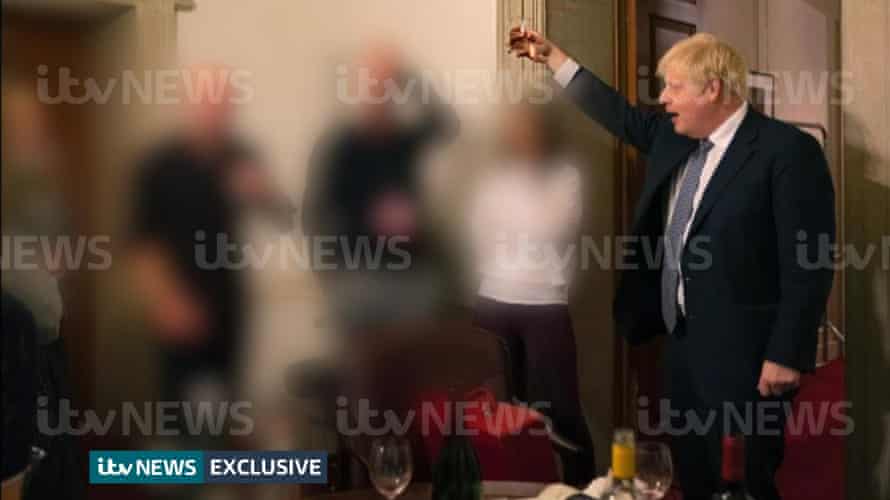 A photograph obtained by ITV News of the prime minister raising a glass at a leaving party.