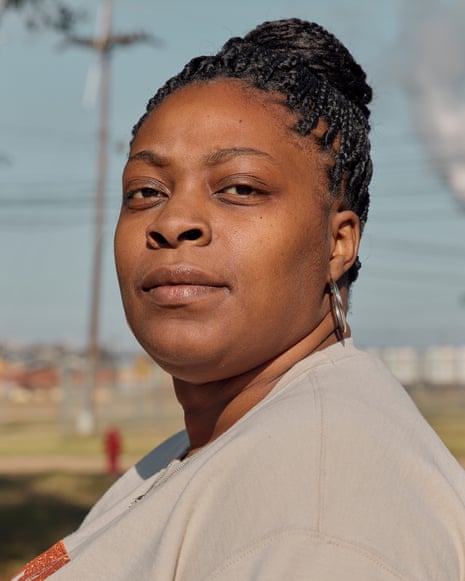 A Black woman standing for a portrait outside