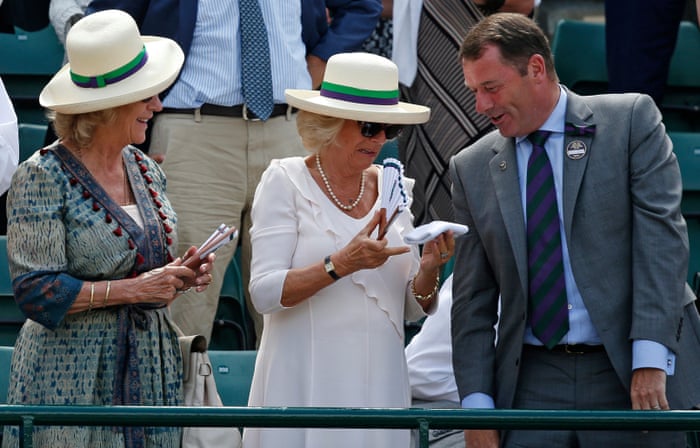 <strong>Day four</strong><br>The chairman of the club Phillip Brook hands a sweatband that Andy Murray threw into the crowd to Camilla Duchess of Cornwall
