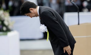 Japanese Prime Minister Shinzo Abe bows in front of the Peace Prayer statue in Nagasaki. It is expected he will include the word ‘apology’ in an anniversary statement later this week.