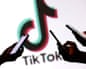 Graphic illustration of three hands holding cell phones, with TikTok logo n the background.