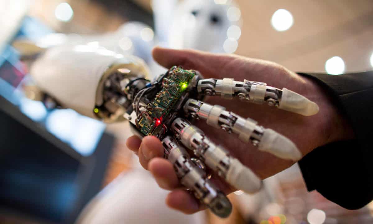 Human holding hands with an android