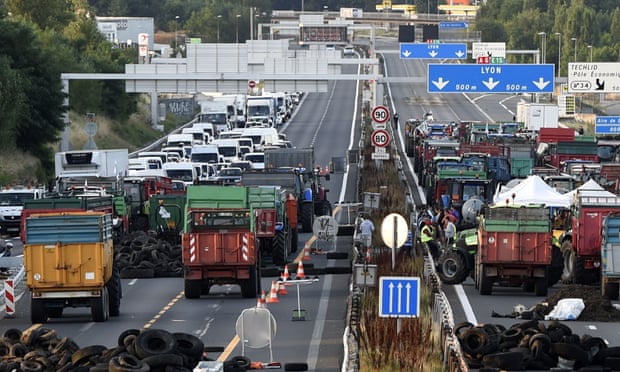 Farmers block the A6 motorway with tractors, farm trailers and tyres at the northern entrance to Lyon, one of the key arteries to southern regions.