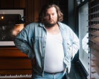 Tyler Ballgame next to a window.