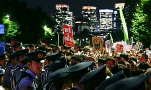 Japanese police block demonstrators outside Japan’s parliament in Tokyo on Wednesday.