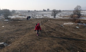 A migrant child walks from the Macedonian border into Serbia, near the village of Miratovac.