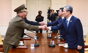 Hwang Pyong-so, front left, and Kim Kwan-Jin, front right, in talks. 