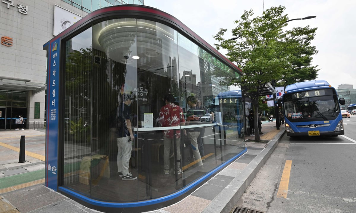 South Korea installs anti-virus bus shelters with temperature sensors and UV lamps | South Korea | The Guardian