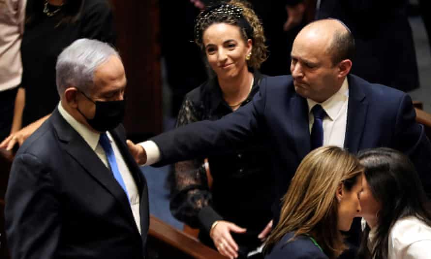 Benjamin Netanyahu and Naftali Bennett follow a vote on the New Deal coalition in Knesset, the Israeli parliament in Jerusalem, on Sunday.