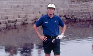 Jean van de Velde looks bemused as he tries to
to retrieve his ball from the Barry Burn.