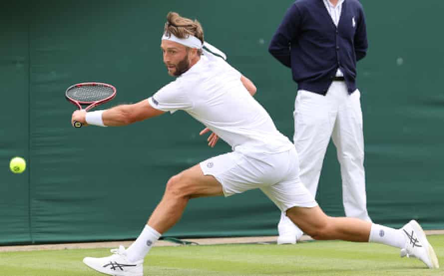 Liam Broady reaches for a backhand.