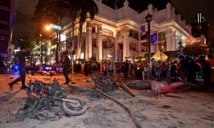 Thai soldiers inspect the scene after a bomb exploded outside a Hindu shrine in central Bangkok, killing at least 12 people and wounding 78.