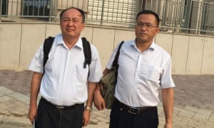 Ma Lianshun (left) and Cai Ying, two Chinese attorneys, have spent weeks searching for Li Heping, a human rights lawyer who disappeared from his home on 10 July.