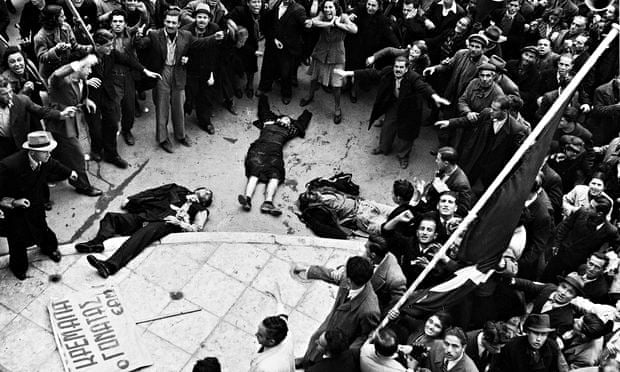 demonstrators in Athens with three bodies, shot dead, in the middle of the crowd
