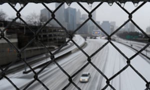 Ice freezes on an interstate overpass in downtown Atlanta.