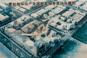A torn poster showing the original plan for Caofeidian Environmental Industries Park. Government and state owned industrial enterprises are said to have invested 561 billion yuan (US $91bn) in the area over the past decade, but the park was never completed.