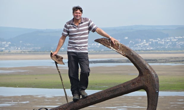 Simon Armitage at Appledore, north Devon, with the walking stick he cut from a holly bush in his gar