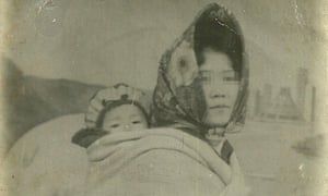 Hyeonseo Lee’s mother carries her, aged three, on her back Hyeonseo Lee’s mother carries her, aged three, on her back