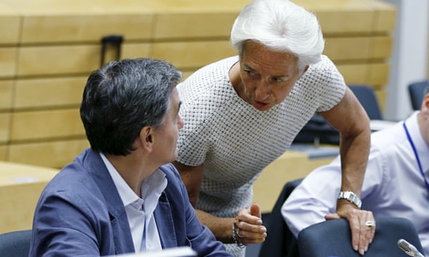 Greek finance minister Euclid Tsakalotos listens to IMF managing director Christine Lagarde