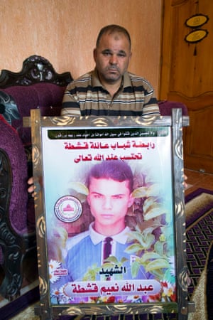 Naim Qishta holds a picture of his son Abdullah, a pupil at Doha school, killed during last summer’s war in Gaza during an Israeli attack. The Doha boys’ secondary school in Rafah lost more pupils during the war than any other.