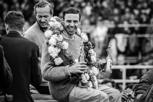 Jim Clark celebrates after winning the 1965 British Grand Prix at Silverstone.
