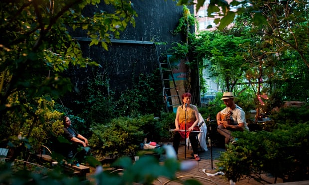 Swiis musicians Nuevo Amanecer (Regula Kuffer on flute, Nick Perrin on flamenco guitar) perform at Le Petit Versailles garden.