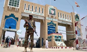 Pakistan security official stands guard at Pakistan-Afghan border 