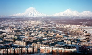 Two active volcanoes loom over the Russian city of Petropavlovsk-Kamchatsky.