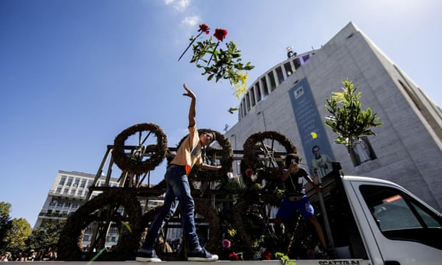 Flowers are tossed in front of the Don Bosco church for Vittorio Casamonica's funeral.