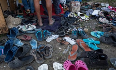 People's shoes left outside the migrant church in Calais