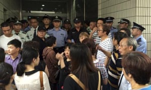 Relatives of Shanghai passengers on board a cruise ship that capsized in central China, attempt to storm a government office to demand information after the tourist agency which organised the tour failed to help them.