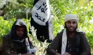 An image from a YouTube video showing Islamist fighters, who claim to be British, appearing in a recruitment video for Isis.