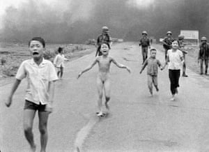Severely burned in an aerial napalm attack, children run screaming for help down Route 1 near Trang Bang, followed by soldiers of the South Vietnamese army's 25th Division, June 8, 1972