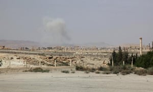 Smoke rises amid shelling from Islamic State fighters in Palmyra city, Syria.