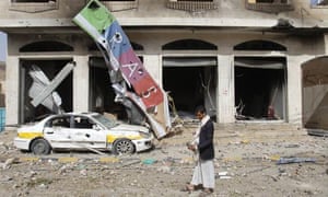 A street is littered with debris after a Saudi-led air strike against Houthi rebels in Sana’a on Monday.