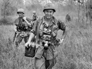 AP photographer Horst Faas, with his Leica cameras around his neck, accompanies US troops in War Zone C