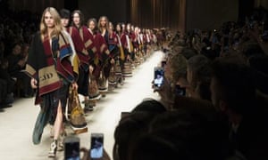 Burberry ponchos have driven sales growth in the past year.