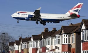 A BA 747 flies over rooftops in west London as it approaches Heathrow.