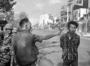 Gen. Nguyen Ngoc Loan, South Vietnamese chief of the national police, fires his pistol into the head of suspected Viet Cong official Nguyen Van Lem on a Saigon street early in the Tet Offensive, February 1, 1968