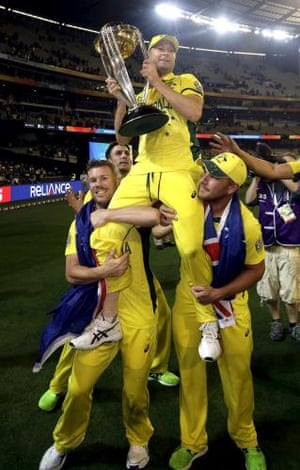 Australia’s captain Michael Clarke is carried on the shoulders of team-mates David Warner, left, and Aaron Finch as they parade the Cricket World Cup trophy around the MCG.