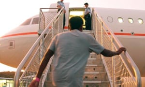 Asylum seekers leave Christmas Island for Nauru in 2012.