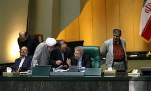 Iran’s parliament speaker, Ali Larijani, second right, speaks with members of parliament during a session in Tehran on Sunday.